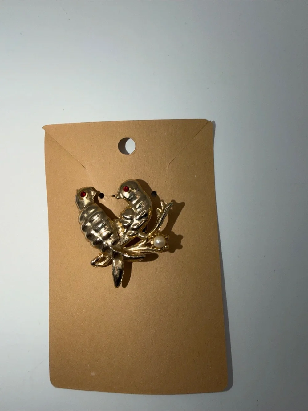 Gold-Tone Two Birds Brooch with Red Eyes and Pearl Accent
